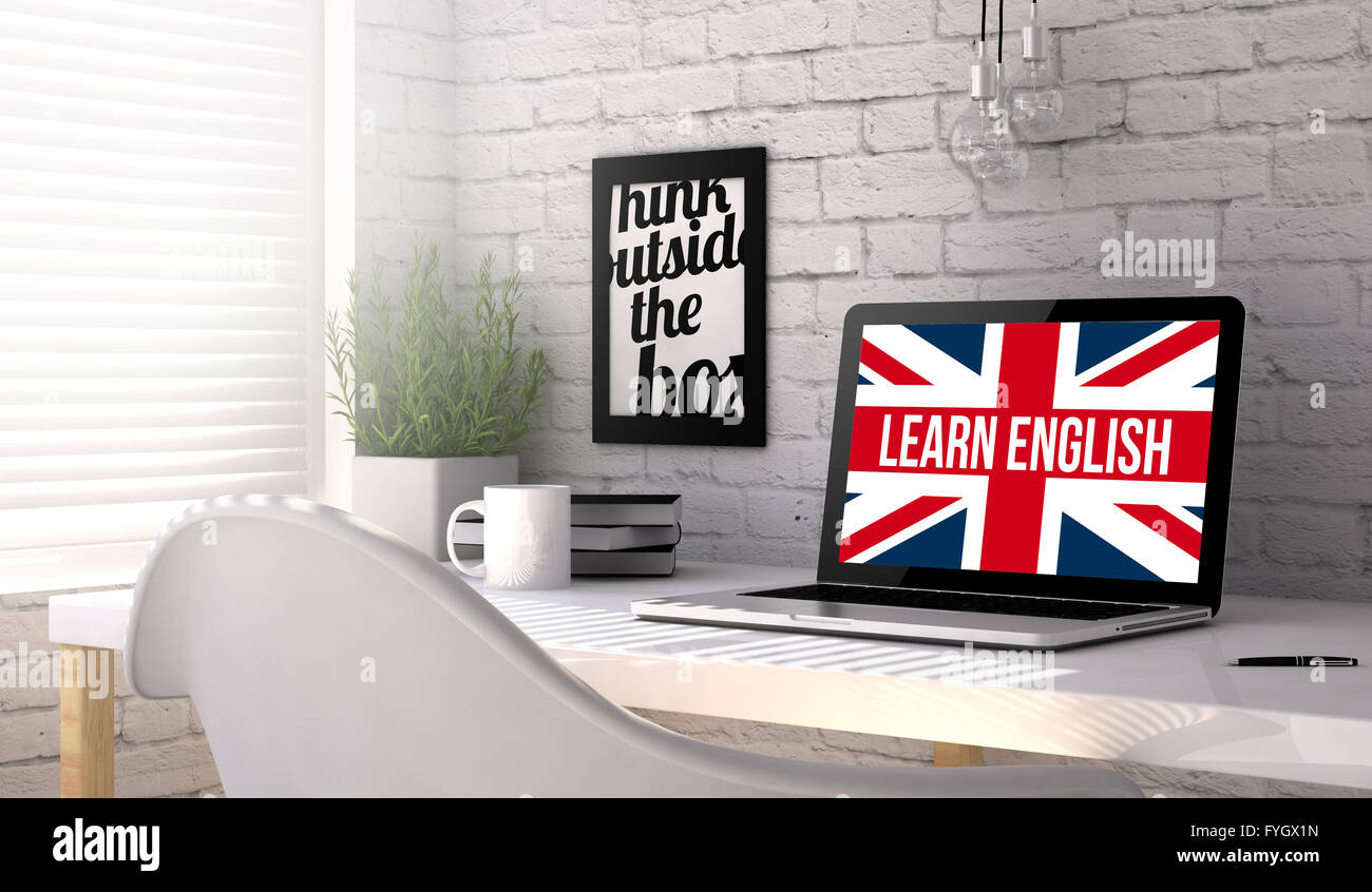 workplace with laptop. learn english on screen. All screen graphics are made up. Stock Photo