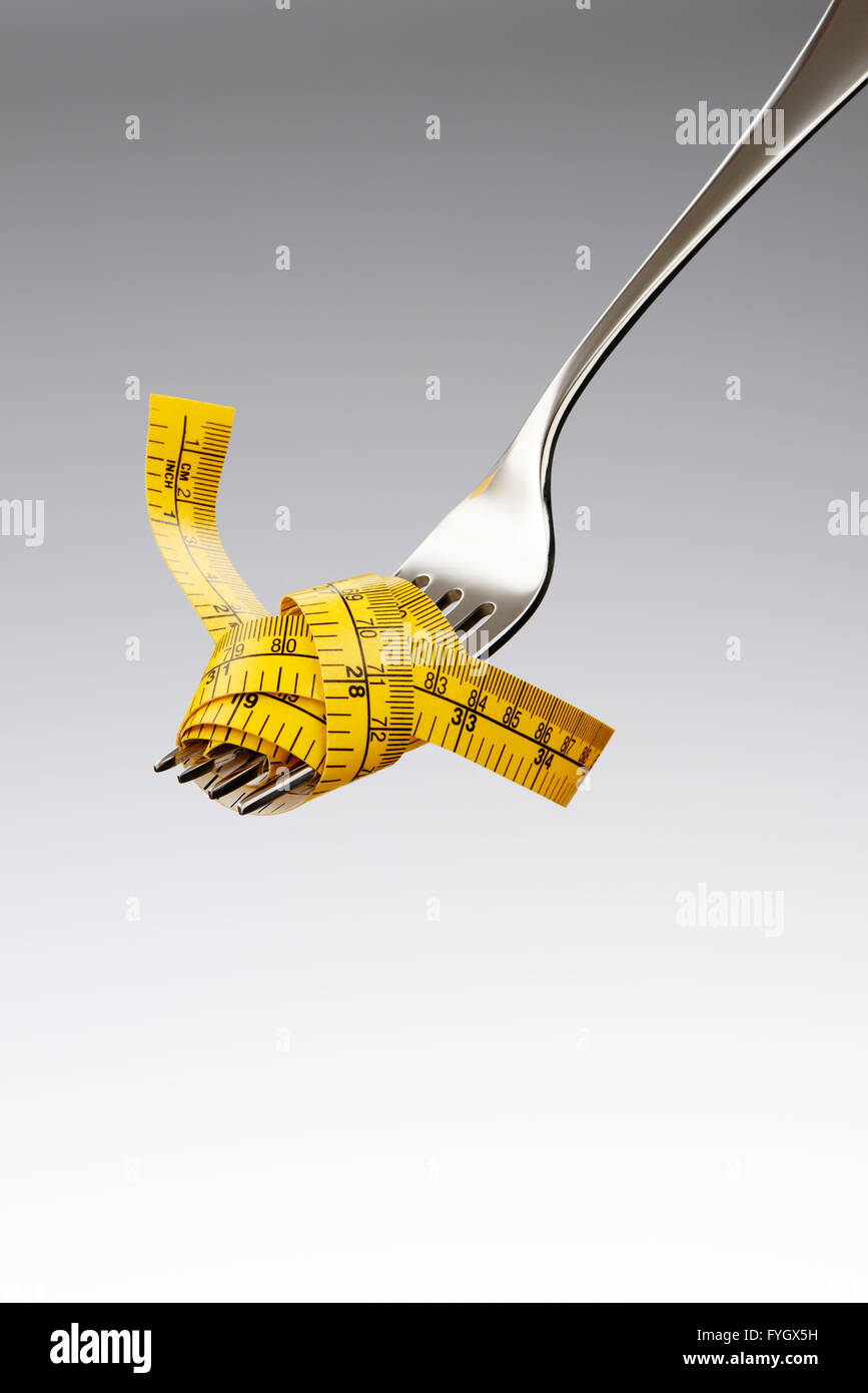 Fork with Tape Measure Dieting Concept Obesity Stock Photo