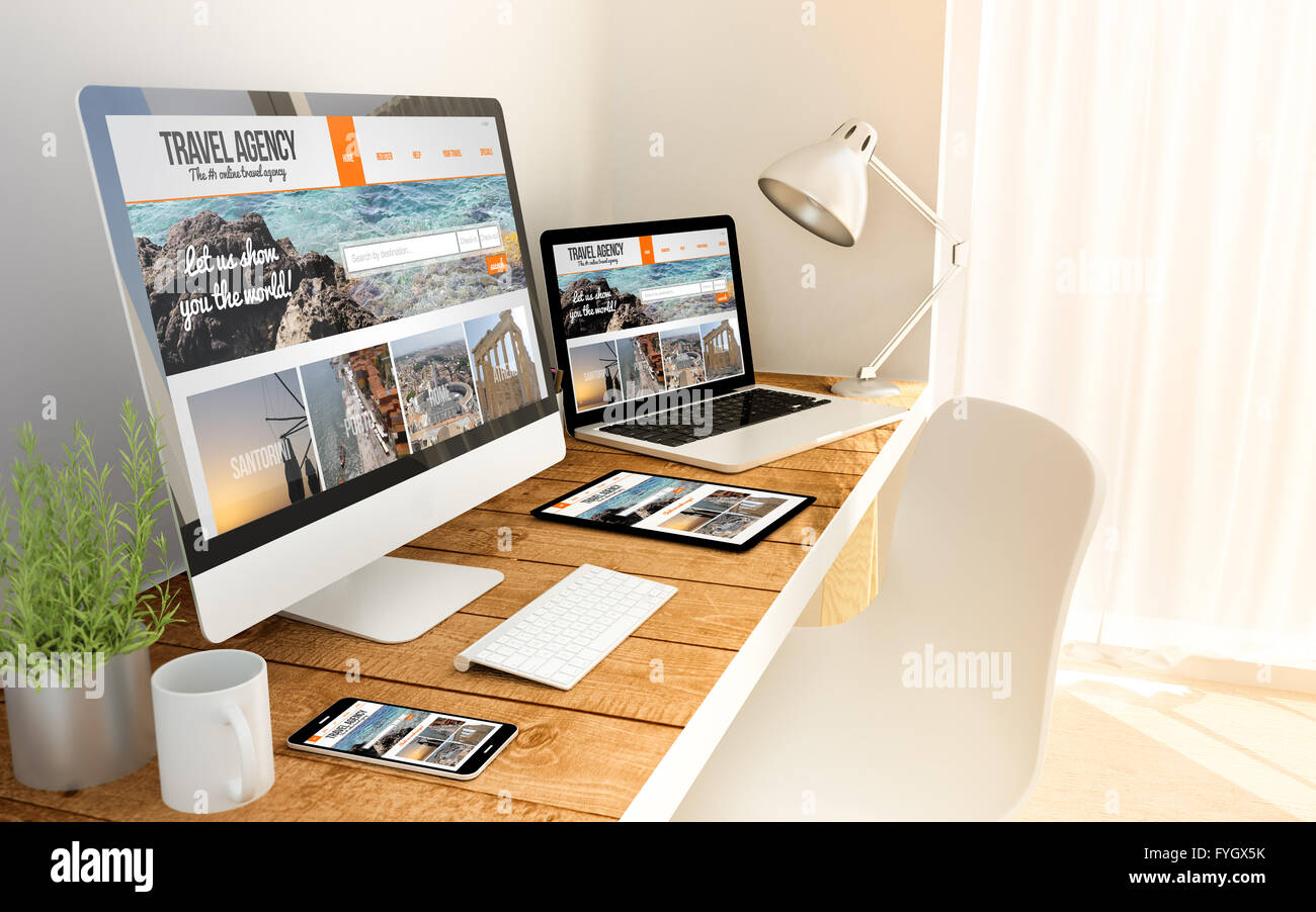 Travel agency responsive web on an hardwood desk on devices mock up. Screen graphics are made up. Stock Photo