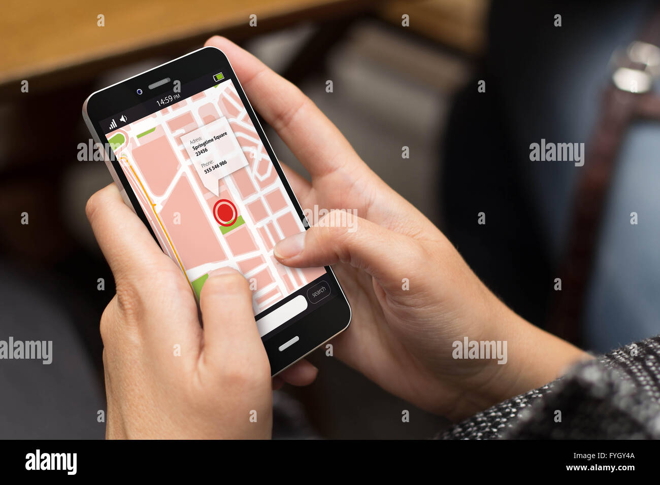 transport concept: girl using a digital generated phone with map on the screen. All screen graphics are made up. Stock Photo