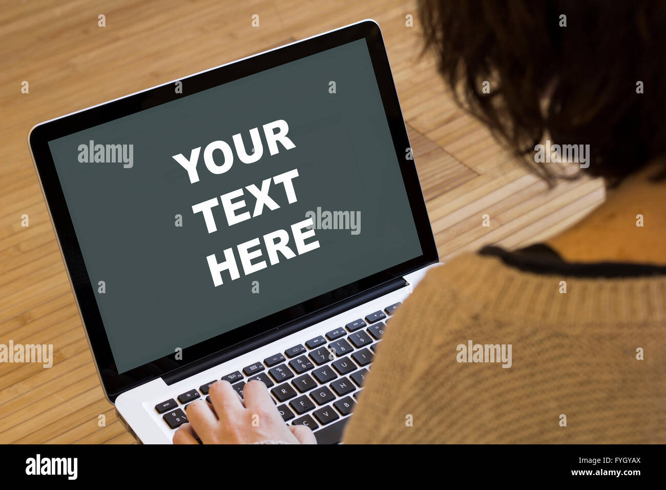 your text here on a laptop screen. Screen graphics are made up. Stock Photo