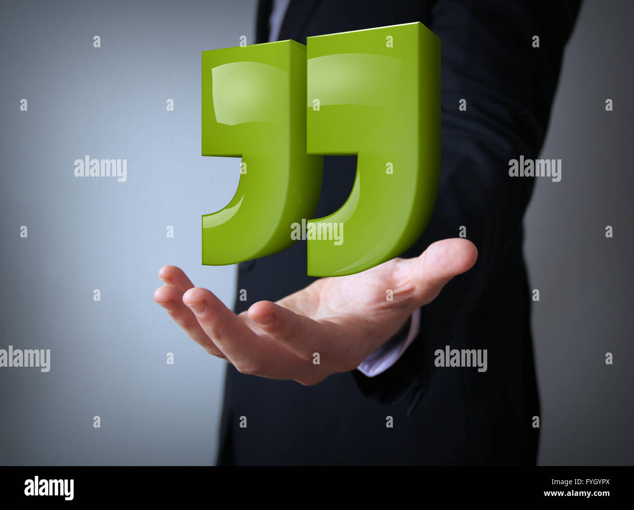green reflective quotes over businessman hand Stock Photo