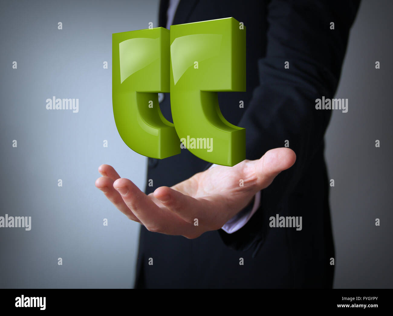 green reflective quotes over businessman hand Stock Photo