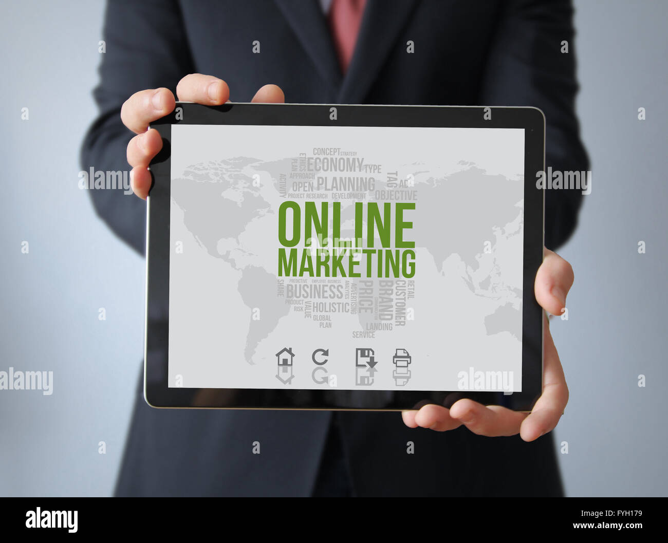 online marketing concept: businessman with online marketing on a tablet. Screen graphics are made up. Stock Photo