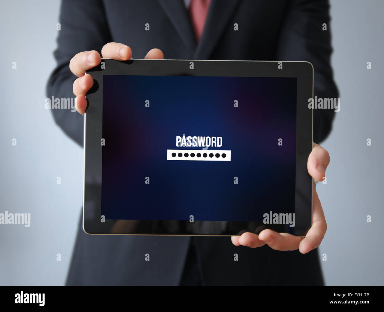 safety concept: businessman with password tablet Stock Photo