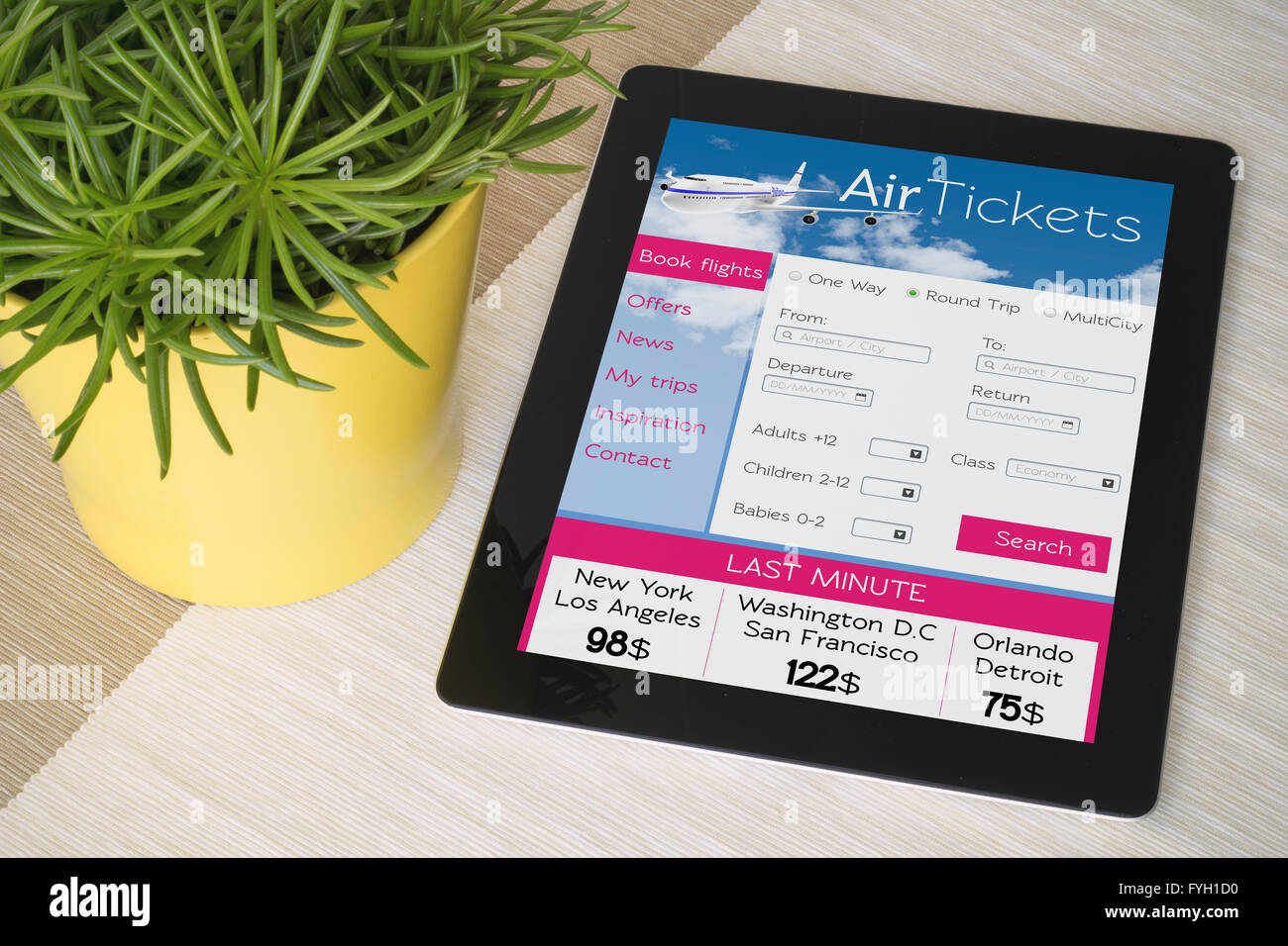 ticket flight web on tablet. All screen graphics are made up Stock Photo