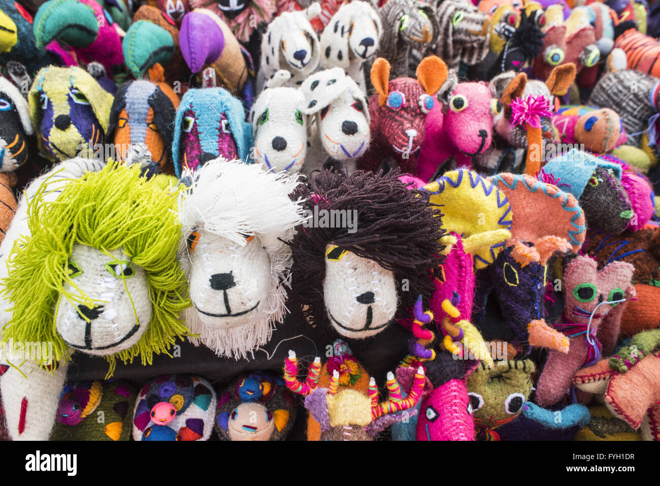 Close up of colorful animal handmade toy souvenirs in display at mexican street market. Stock Photo