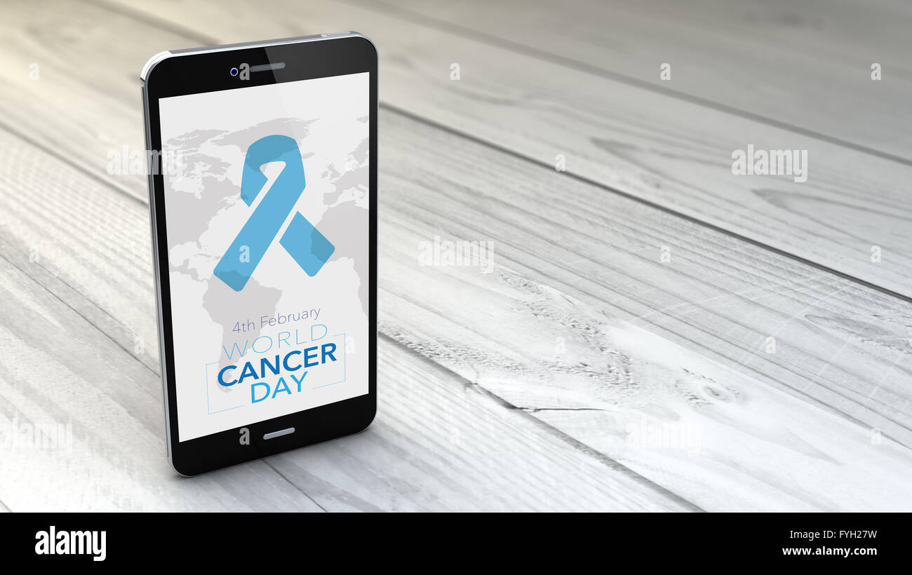 digital generated smartphone with World Cancer Day background over white wooden. All screen graphics are made up. Stock Photo