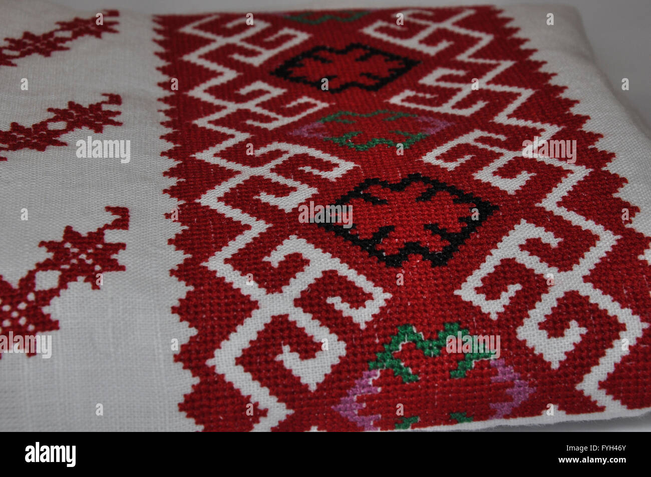 Close-up of traditional Ukrainian embroidery products, linen fabric, embroidery cross Stock Photo