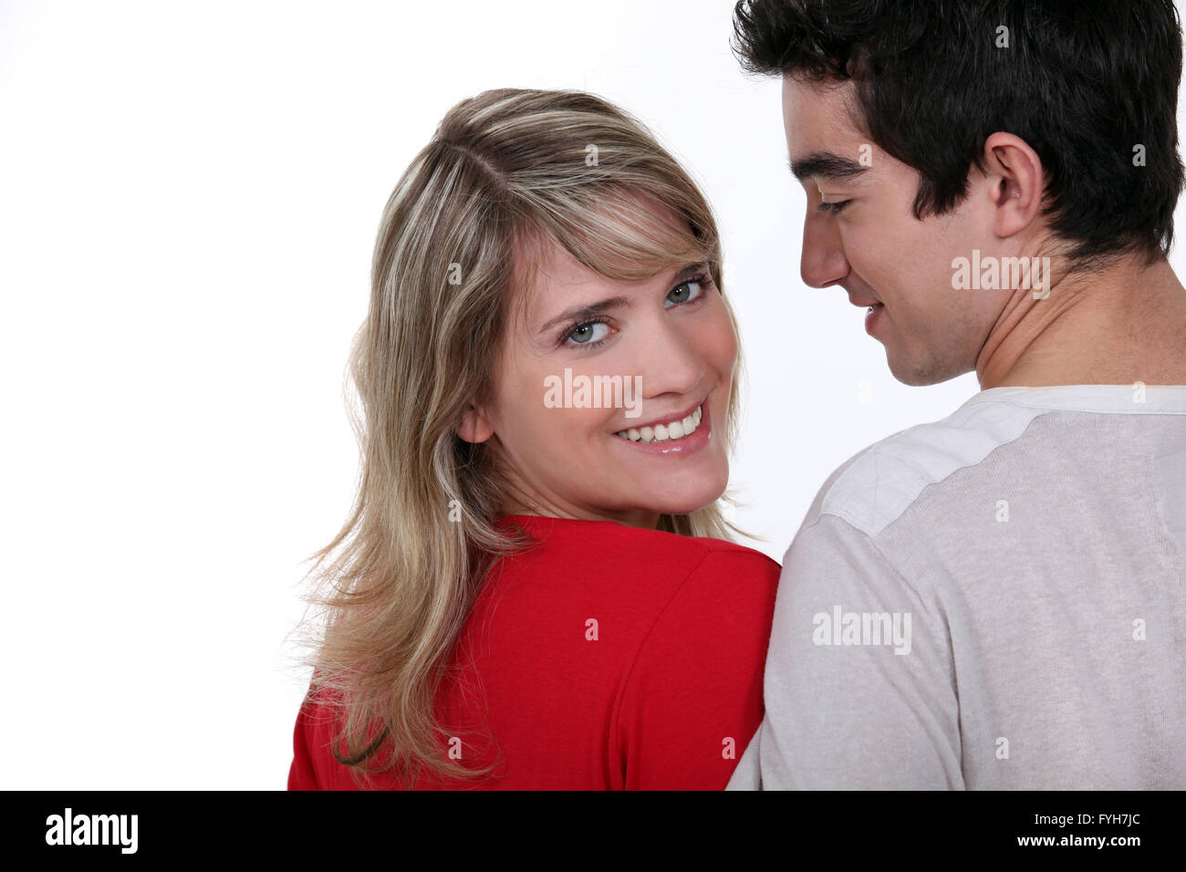 Young man and pretty young woman with bright smile Stock Photo