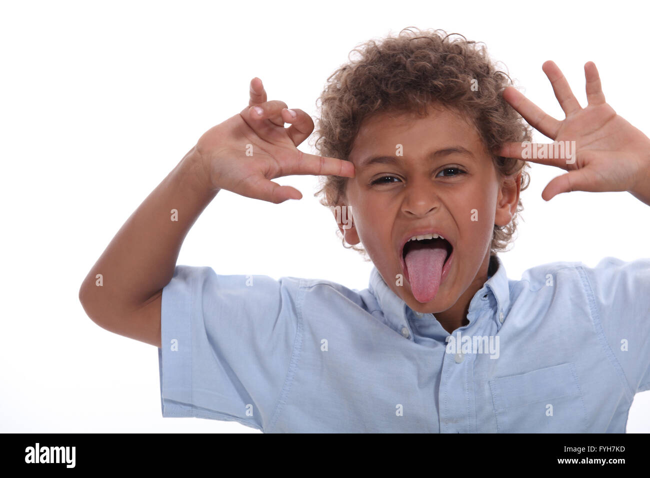 Child pulling face sticking tongue hires stock photography and images