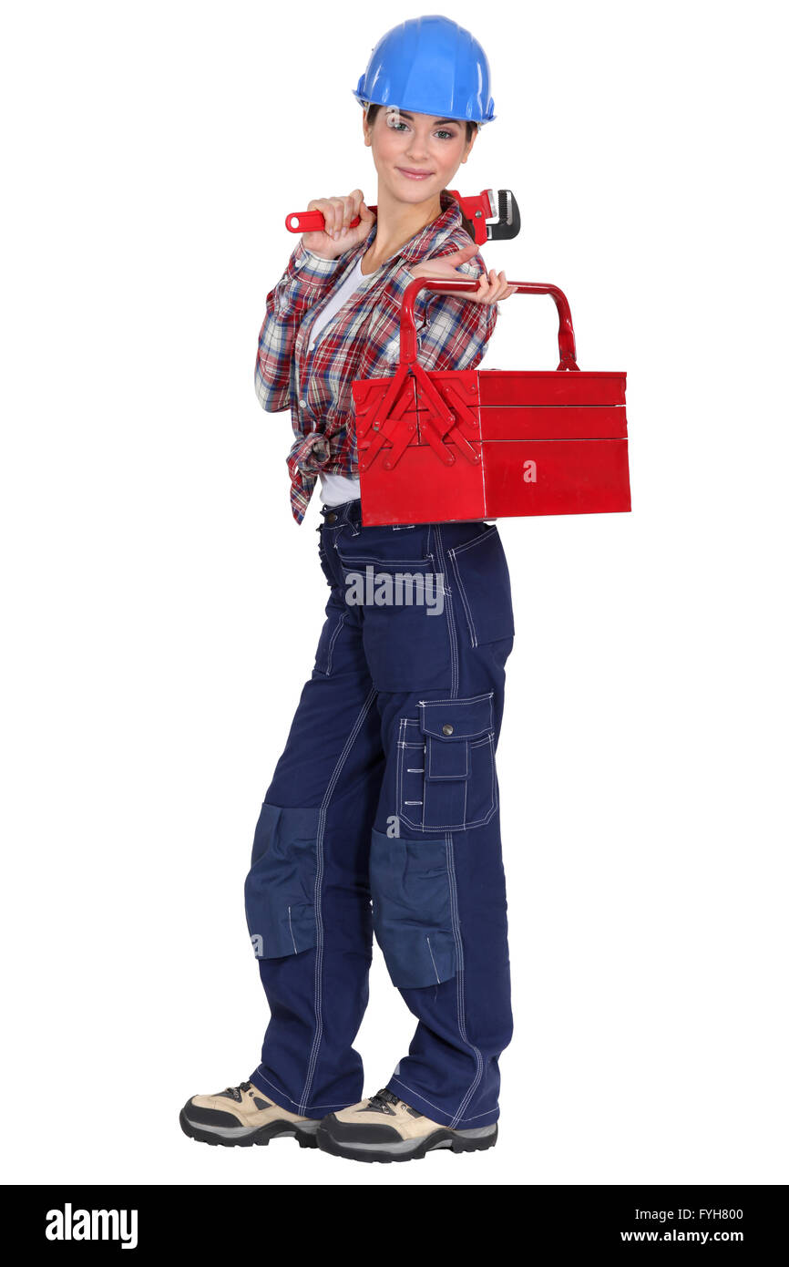 craftswoman holding a spanner and a tool box Stock Photo - Alamy