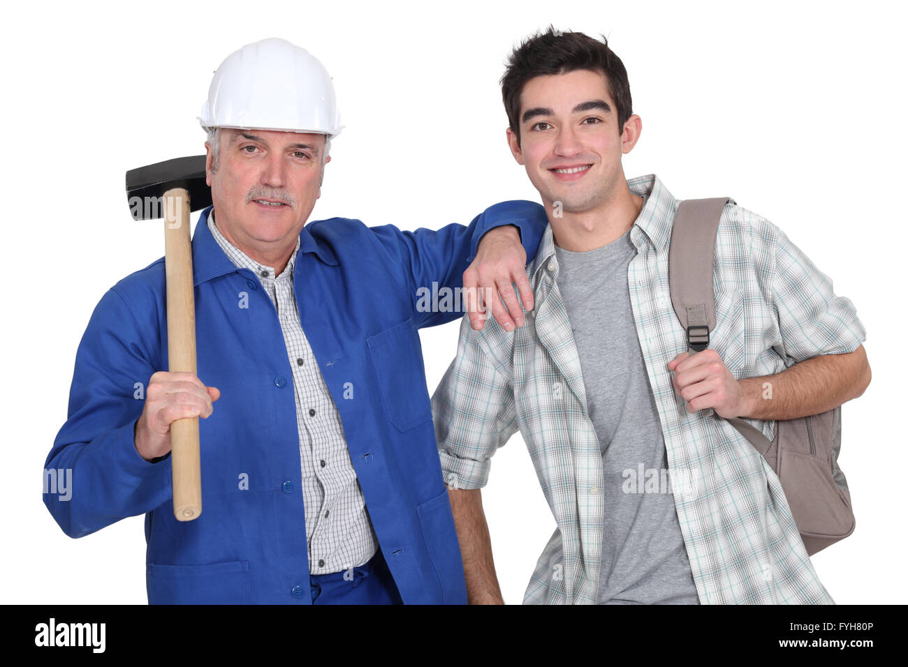 A mature construction worker and his grandson. Stock Photo