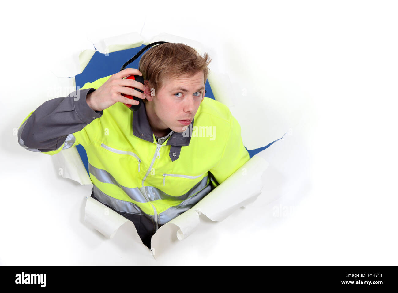 Man wearing reflective jacket and hearing protection Stock Photo