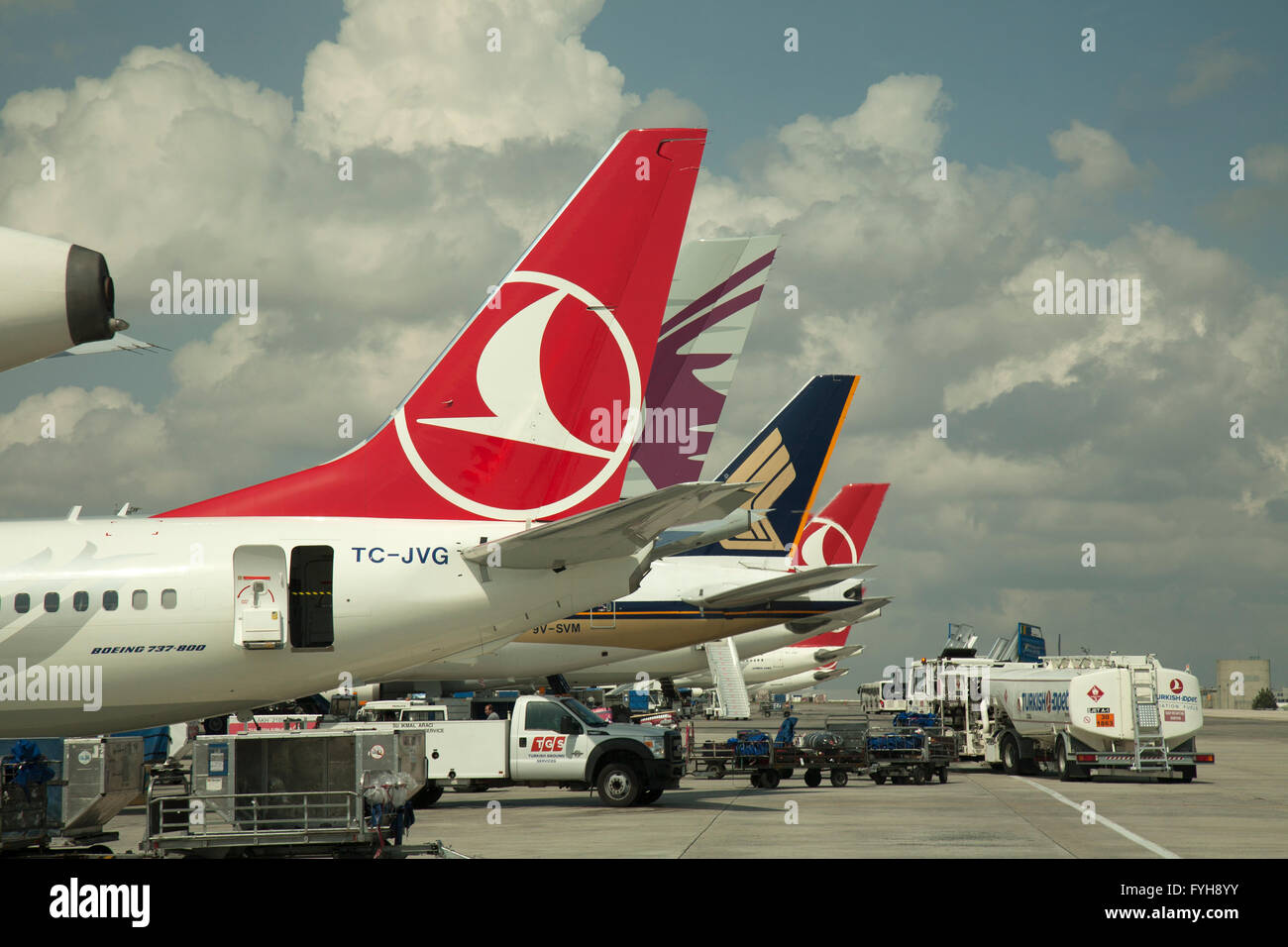 Airliners on the tarmac at Istanbul Airport, Turkey.  Aircraft from Turkish Airlines, Qatar Airlines, and Singapore Airlines. Stock Photo