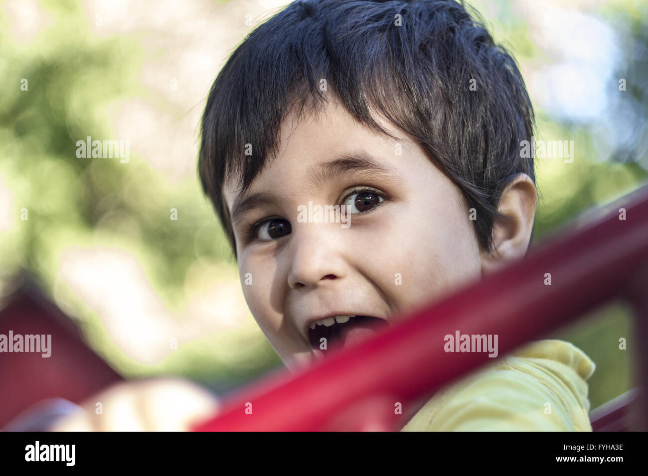 Happy Childhood, cute little baby boy playing at playground Stock Photo