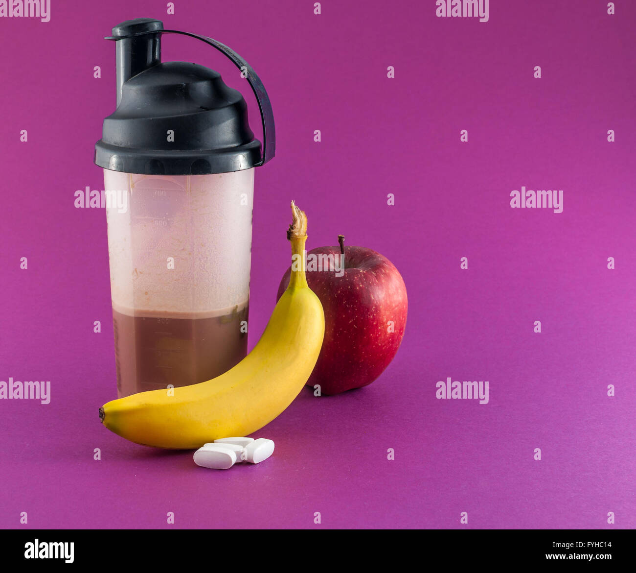 post workout meal with whey protein, shaker, banana and apple Stock