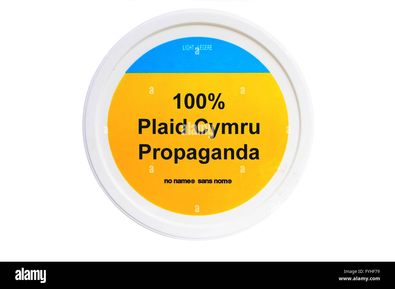 A tub with 100% Plaid Cymru Propaganda written on the label photographed against a white background. Stock Photo