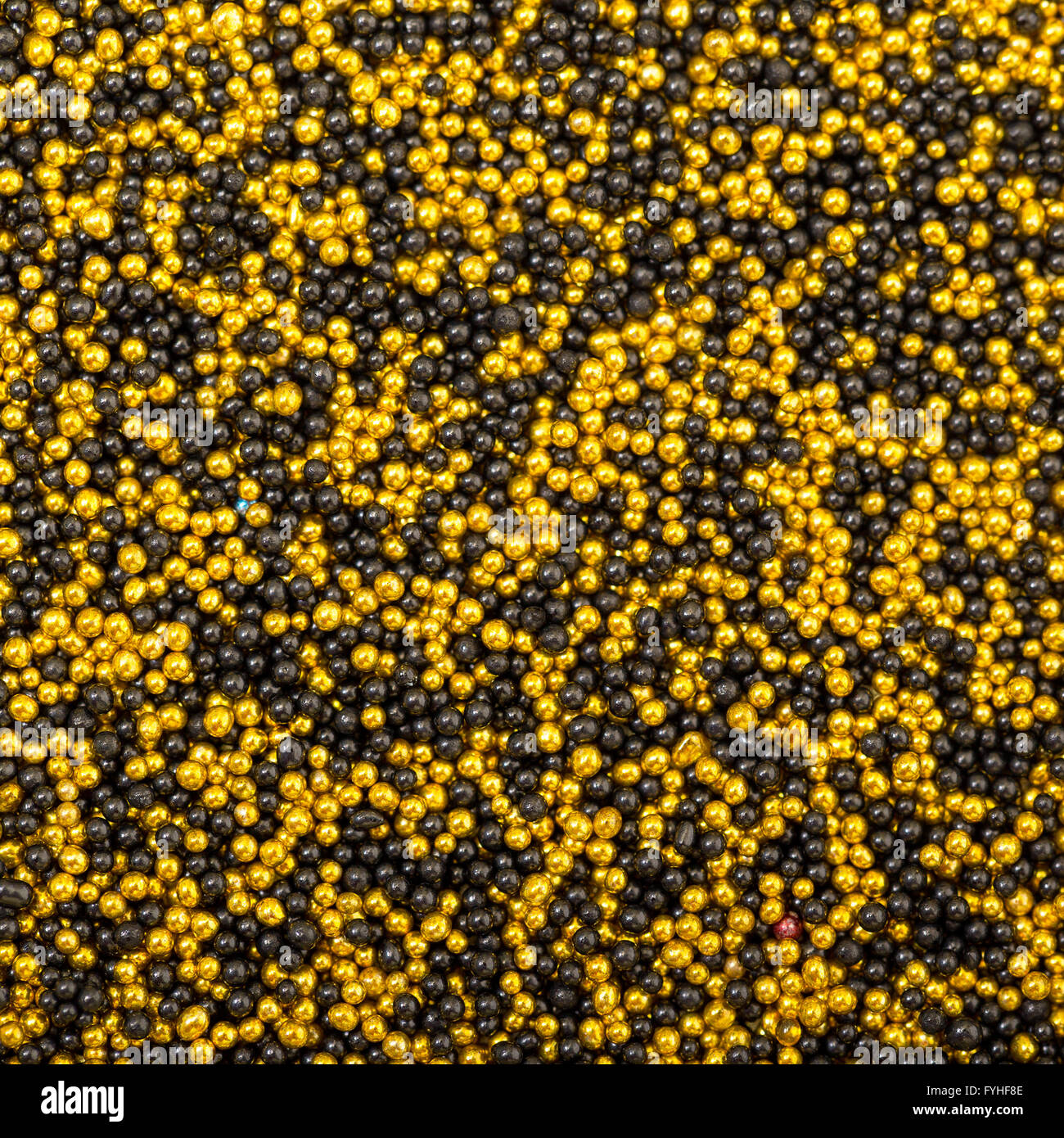 Background from Yellow and Black Balls of Bead Stock Photo - Alamy