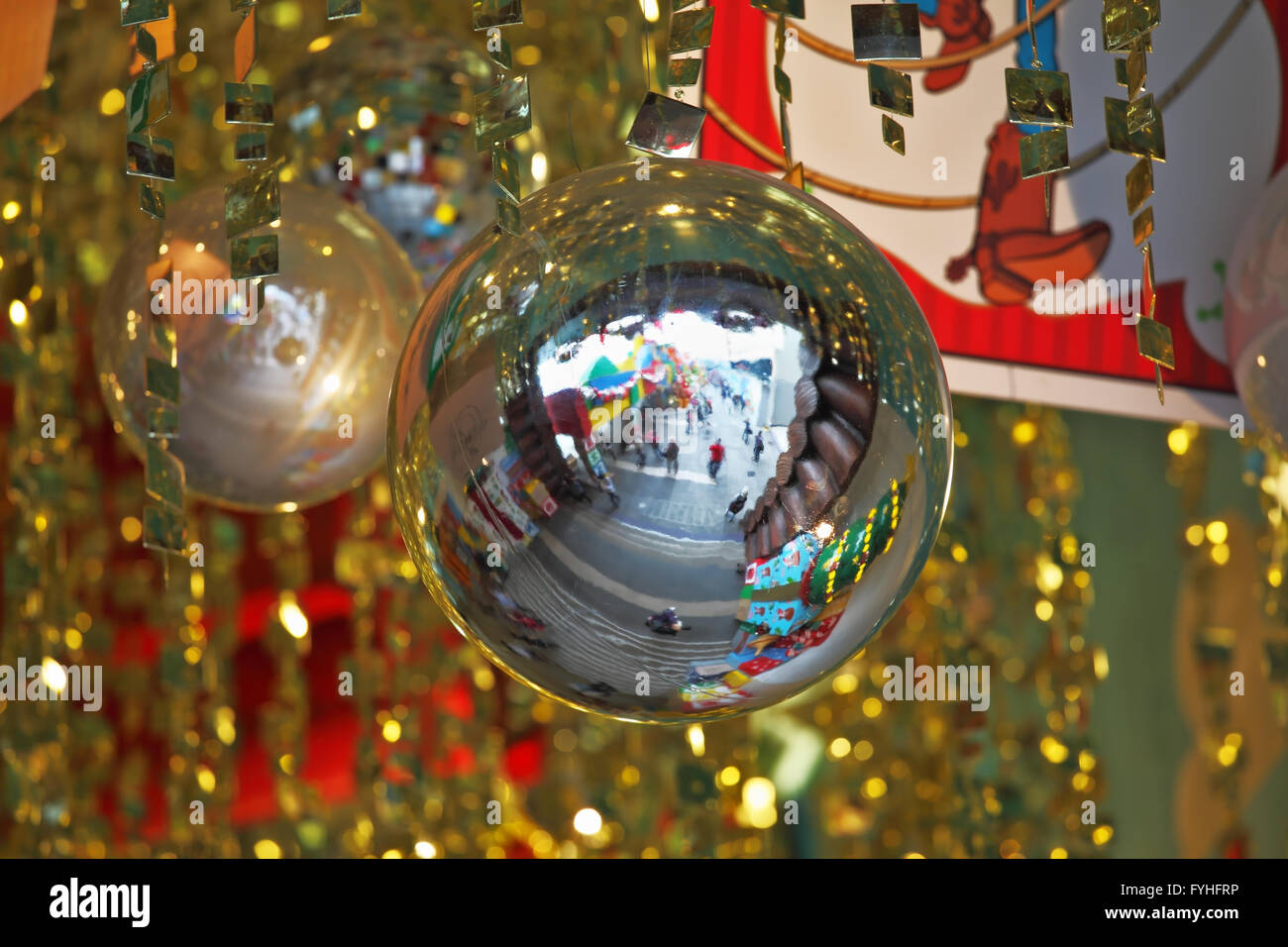 Mirror balls and gold tinsel decorated the hall Stock Photo Alamy