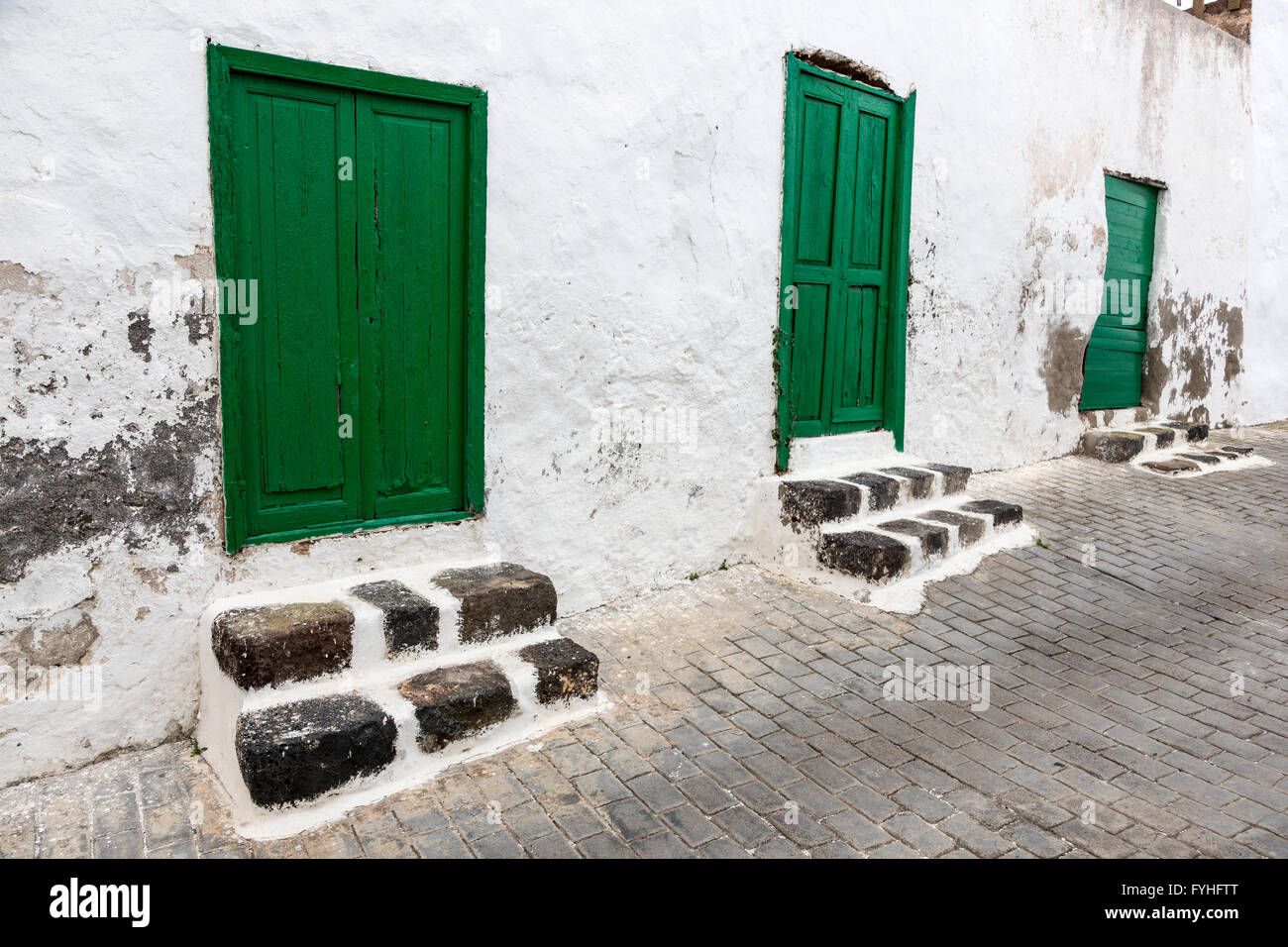 Green doors and steps in street, Tequise, Lanzarote, Canary Islands, Spain Stock Photo