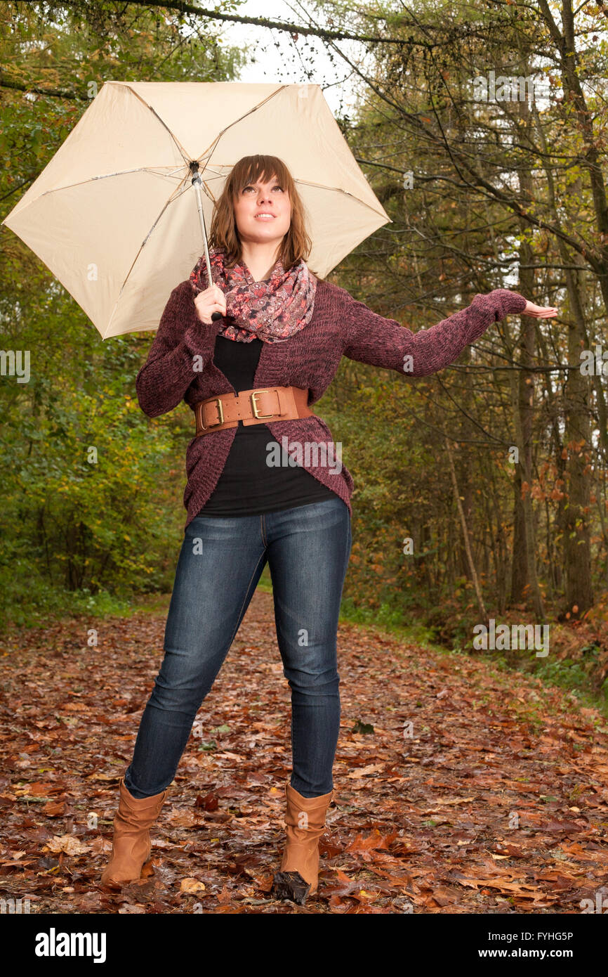 Girl wants to know if its raining Stock Photo