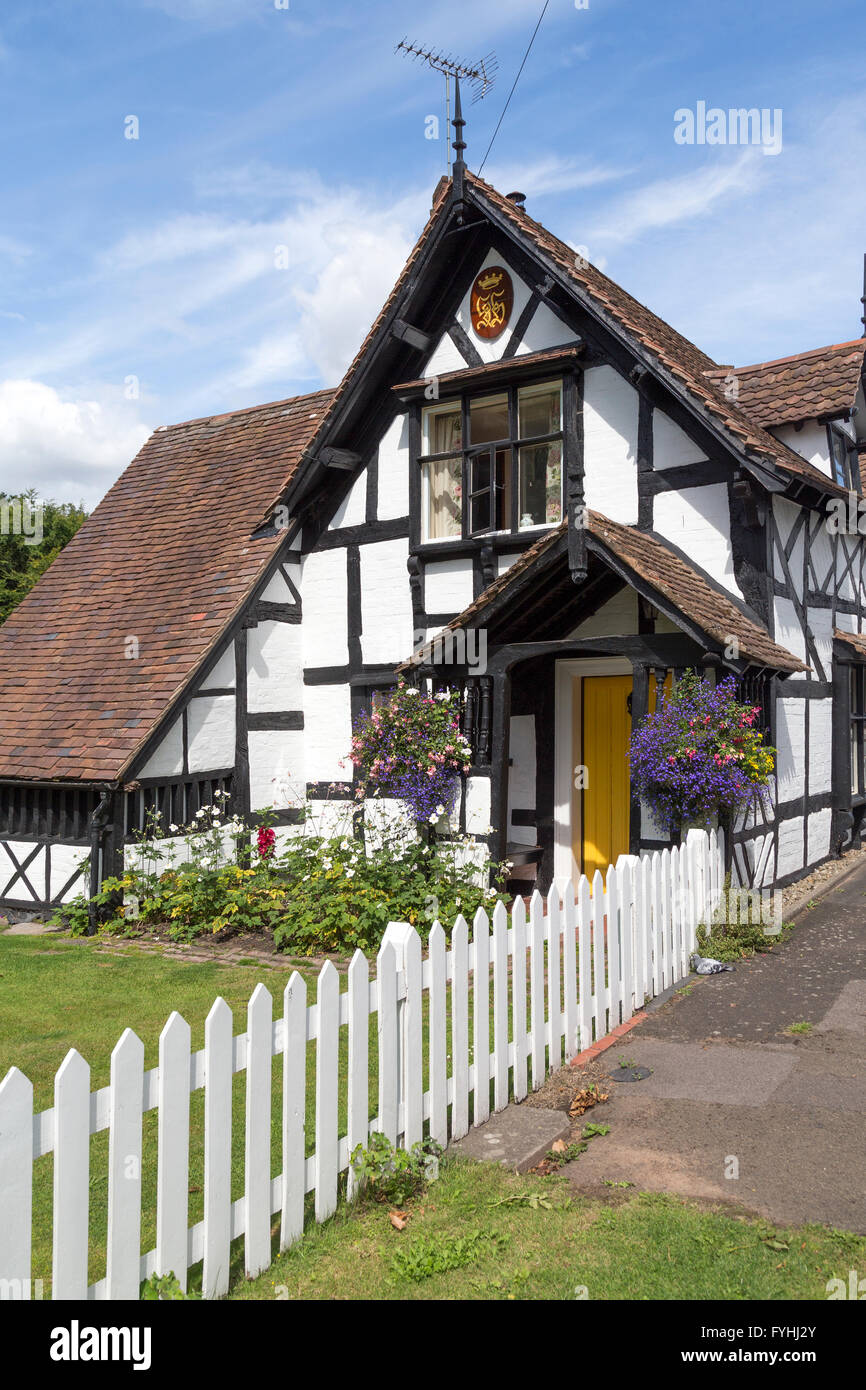 White garden fence and Tudor house, Ombersley, Worcestershire, England, UK Stock Photo