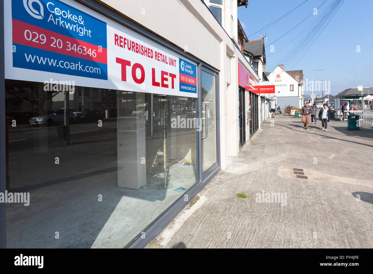 Estate agent sign in empty shop window to let for refurbished retail unit, Cardiff, Wales, UK Stock Photo