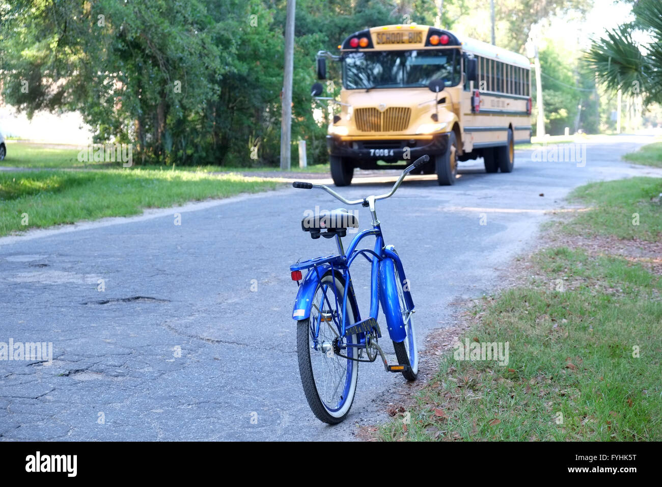 American school bus on a small county road in Florida, near Davenport. April 2016 Stock Photo