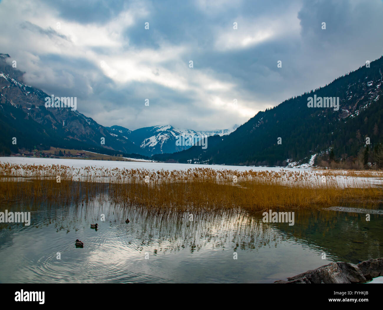 winter landscape with lake partly ice covered Stock Photo