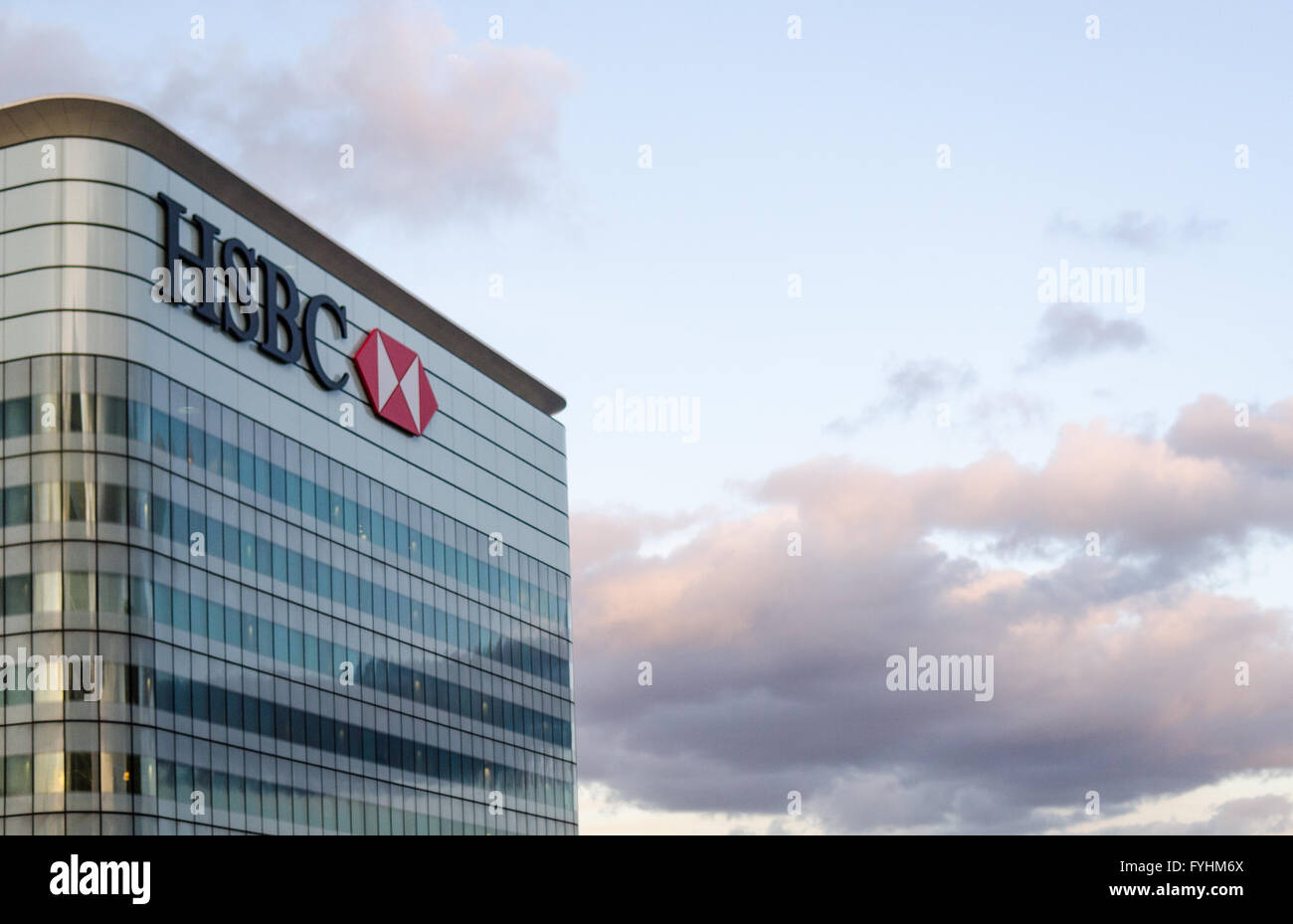 London, England - February 27, 2015: The HSBC logo tops a skyscraper that houses the HSBC global headquarters in London's Dockla Stock Photo