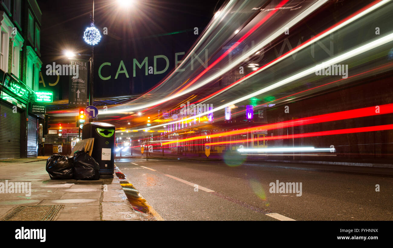 London, England - March 3, 2014: Traffic lit up at night on the Chak Farm Road in busy Camden Town, north London. Stock Photo