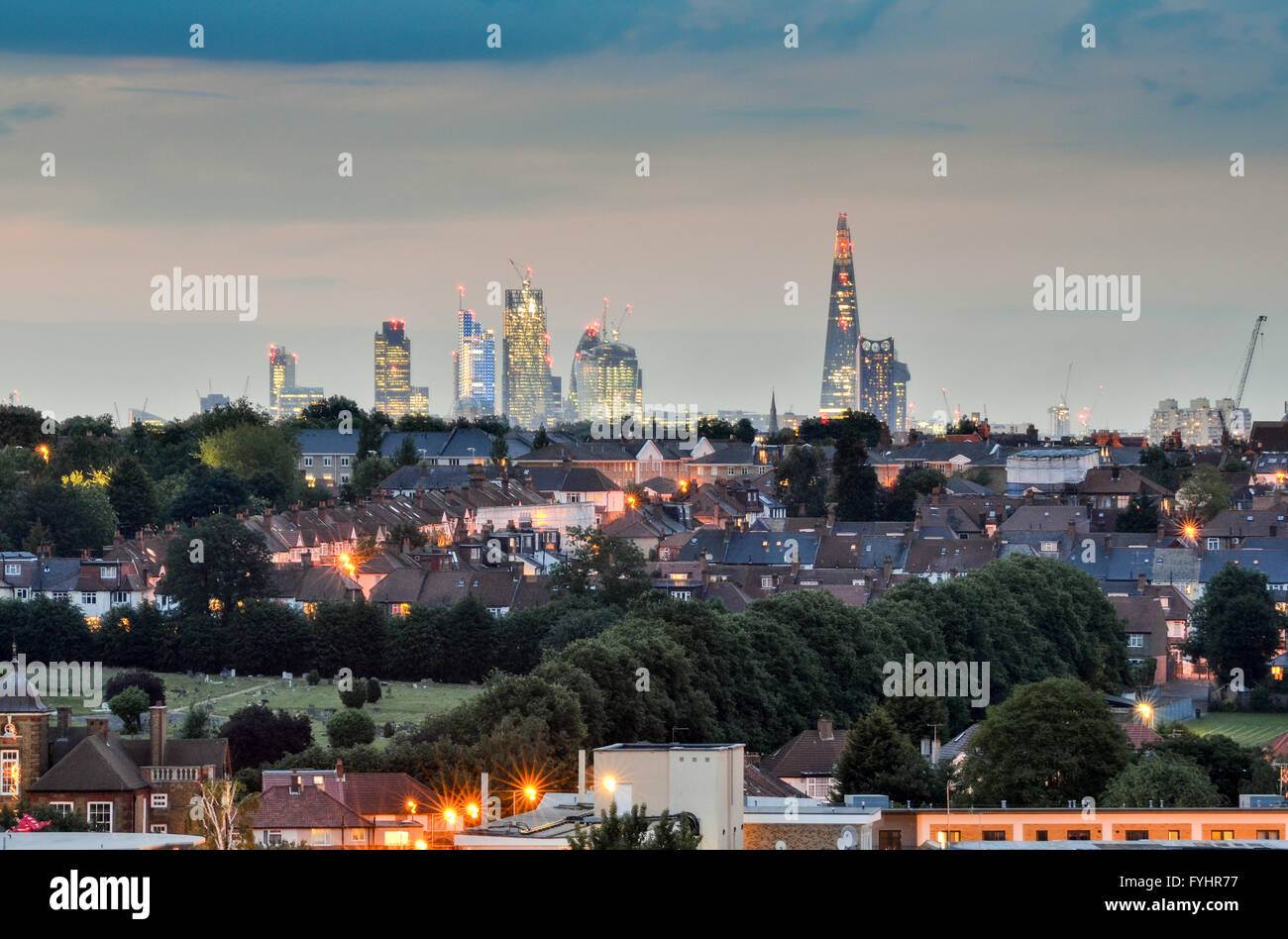 The skyline of London, including The Shard, seen over suburban streets and houses of Tooting in South London. Stock Photo