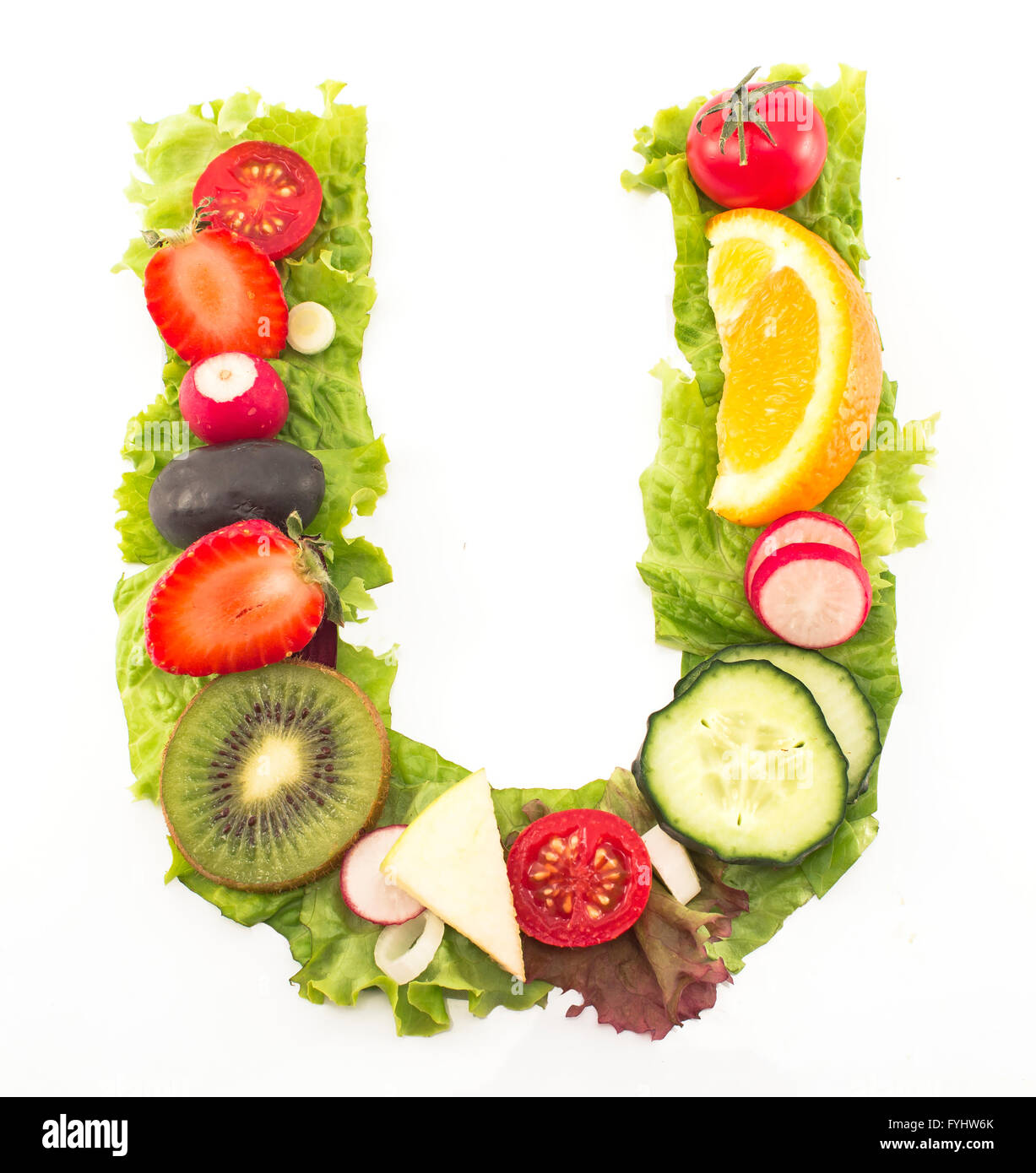 Letter U made of salad and fruits. Stock Photo