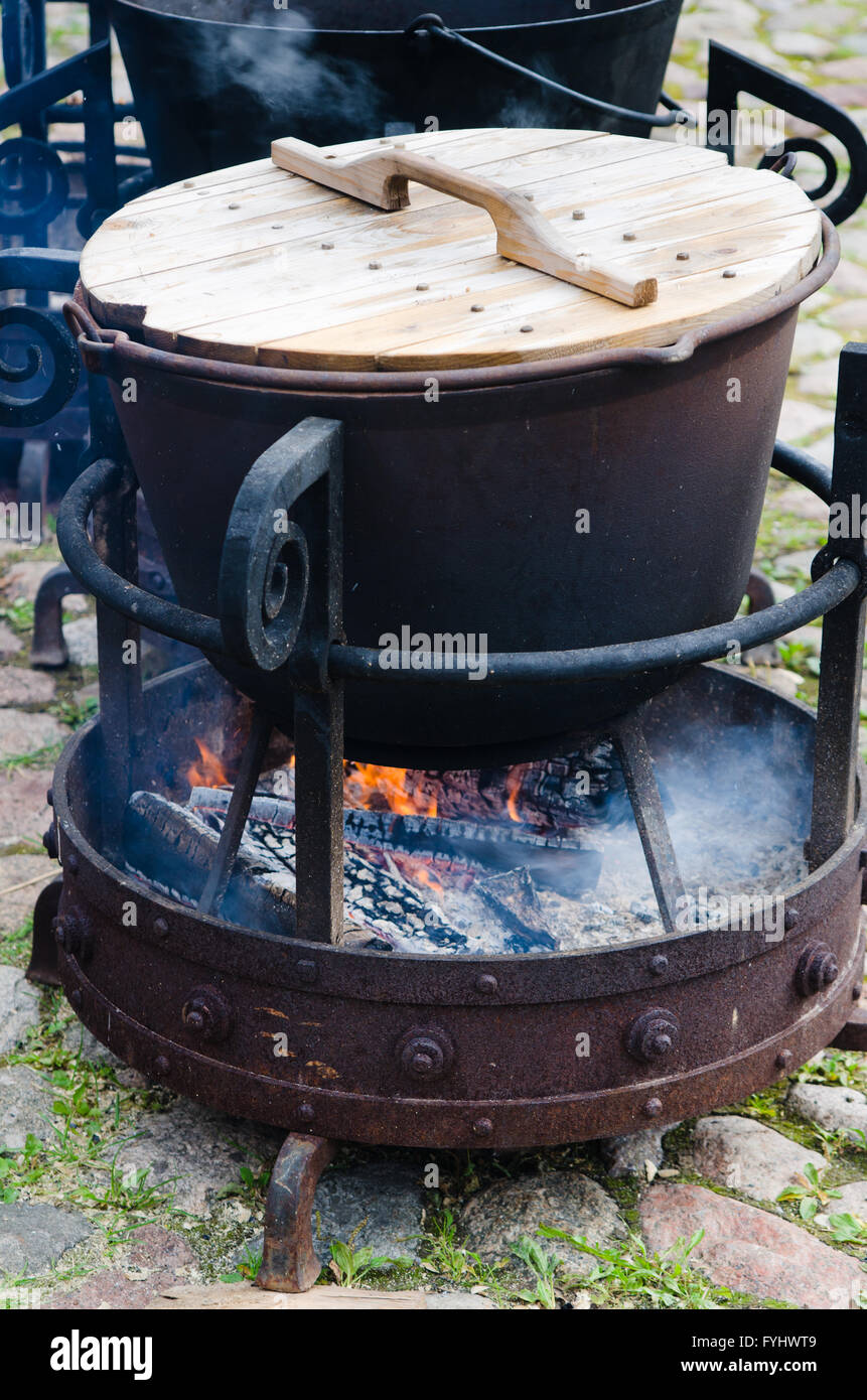 old pot for cooking over a campfire, close-up. Stock Photo