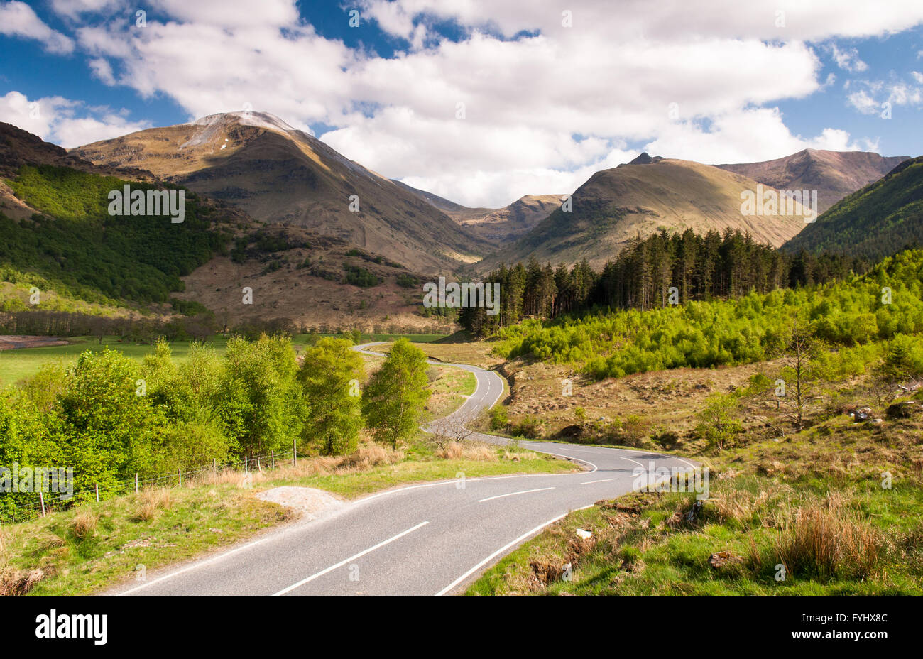 The empty road through the valley of Glen Nevis in the Highlands of Scotland, beneath the mountain Ben Nevis. Stock Photo