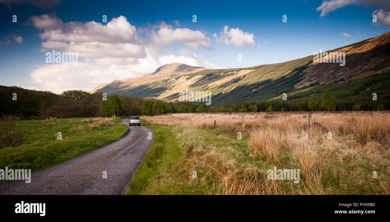 A narrow single-track road in Glen Orchy in the remote West Highlands of Scotland. Stock Photo