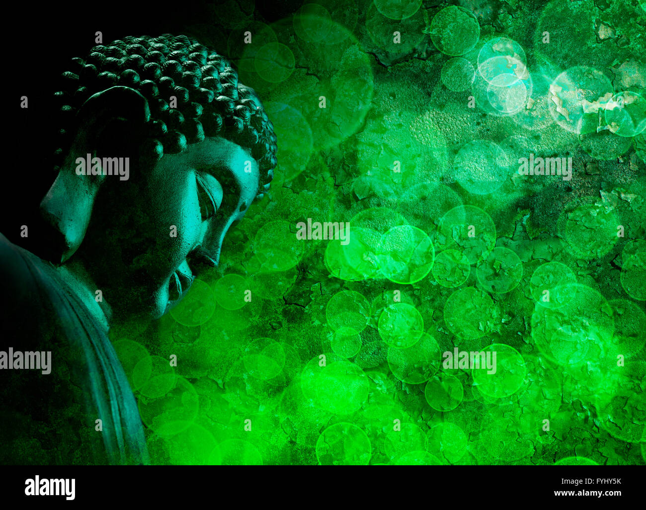 Bronze Zen Buddha Statue Meditating with Blurred Textured Green Background Stock Photo