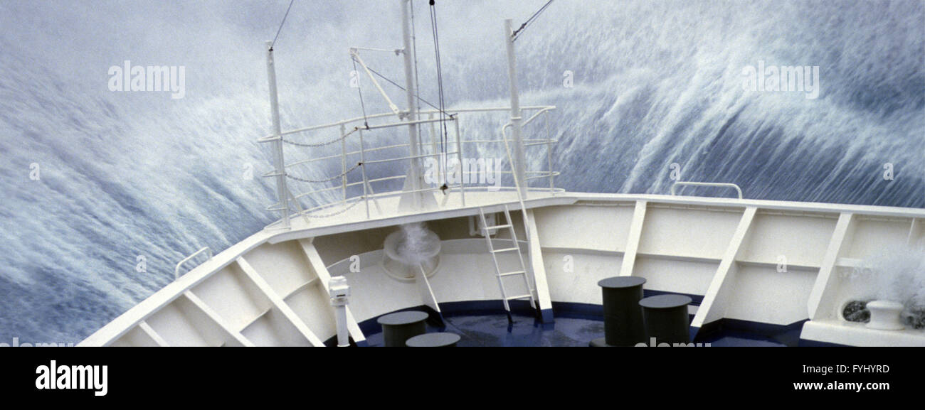 Wave over the foredeck Stock Photo