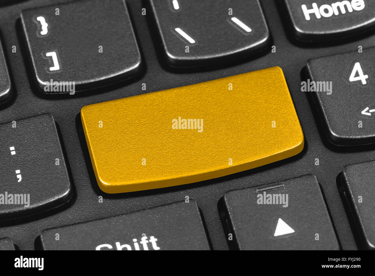 Computer notebook keyboard with blank yellow key Stock Photo Alamy
