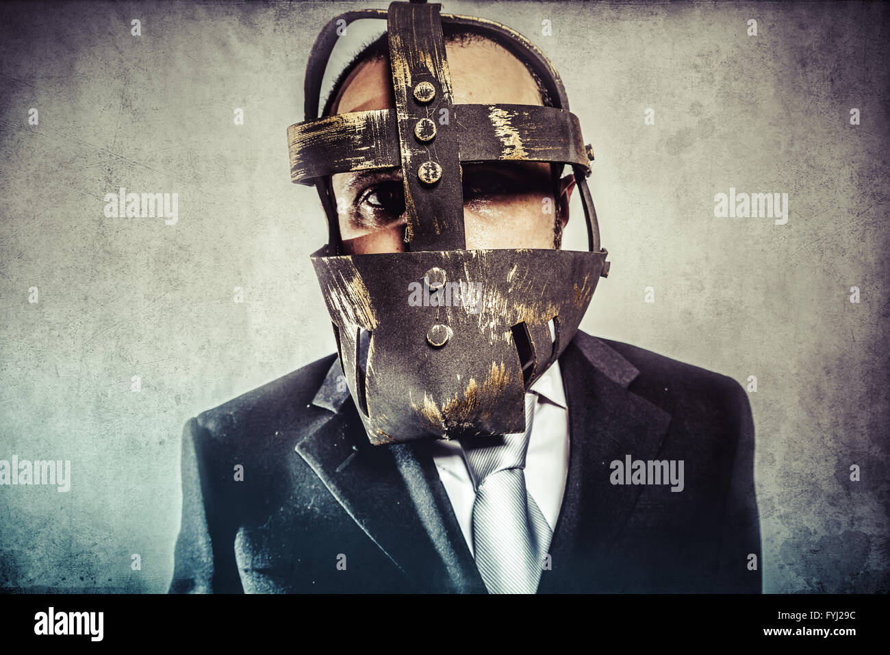 dangerous business man with iron mask and expressions Stock Photo