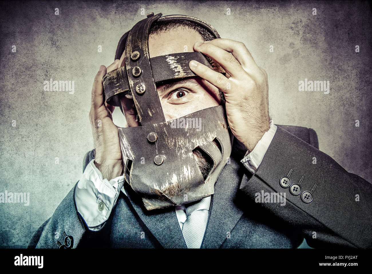 terror, business man with iron mask Stock Photo
