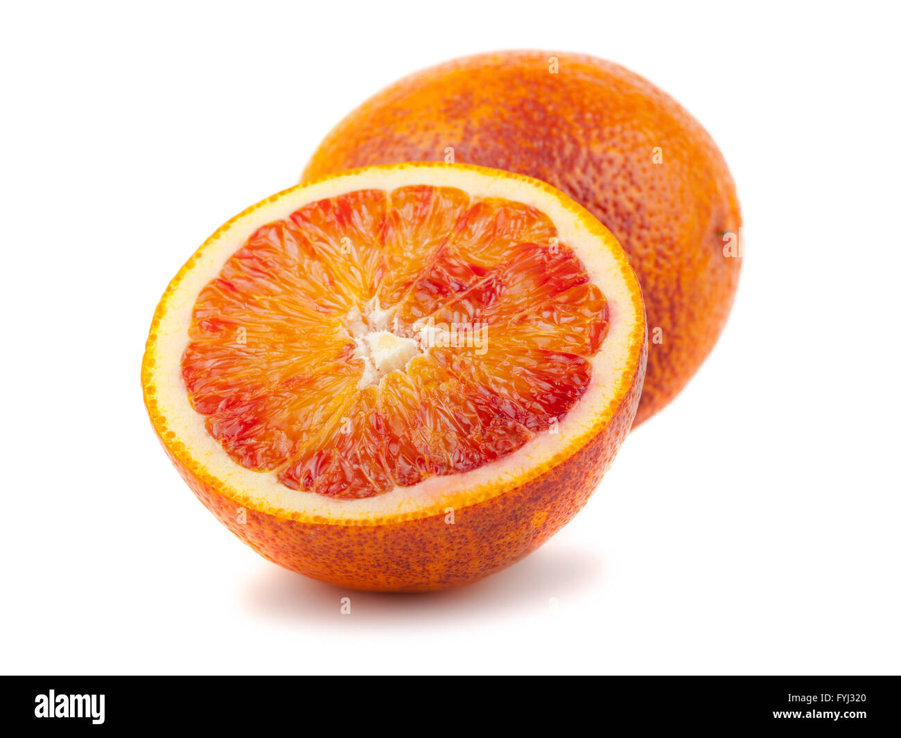 Half and full bloody red oranges Stock Photo