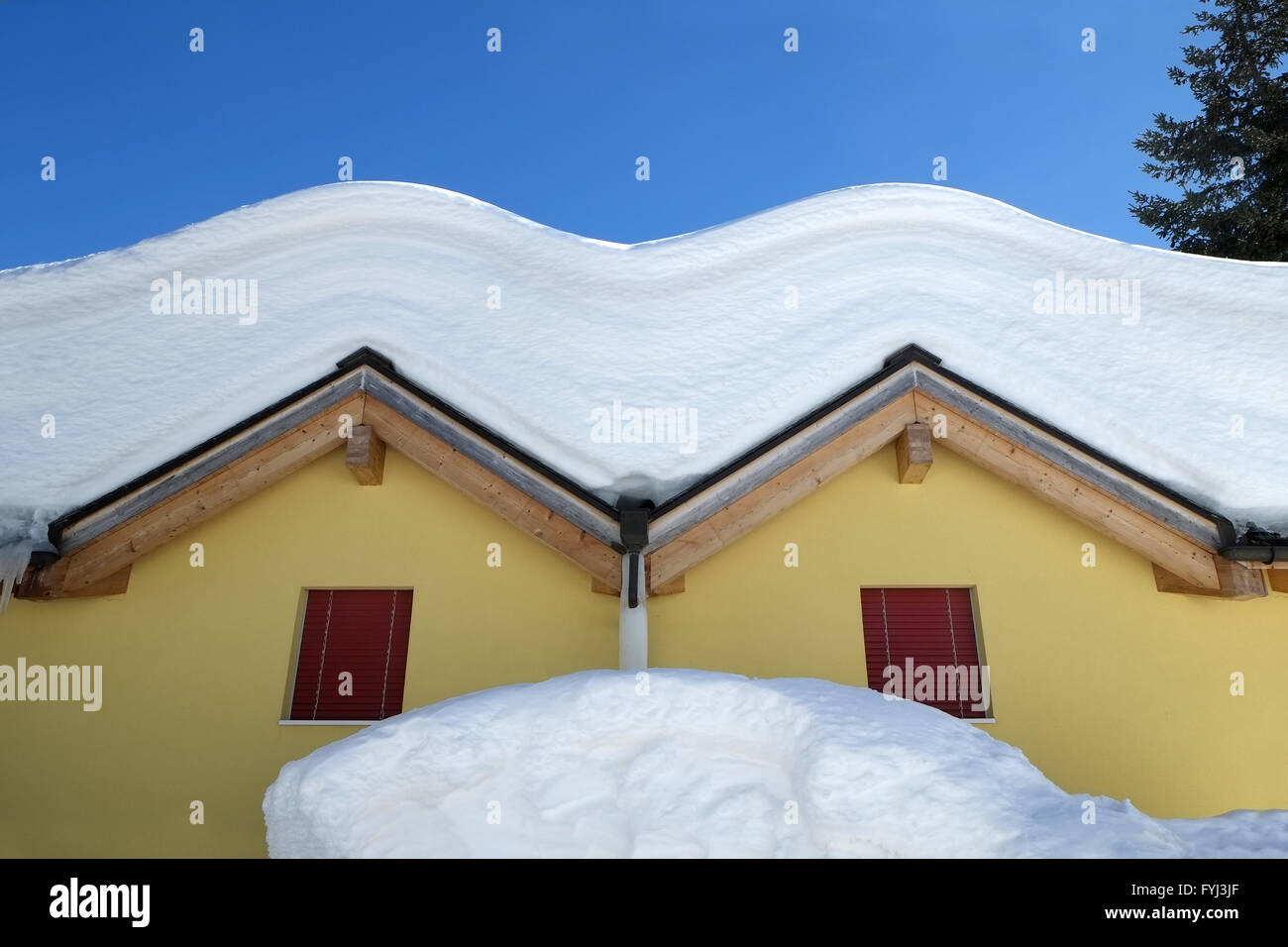A dome of snow sitting on roofs Stock Photo