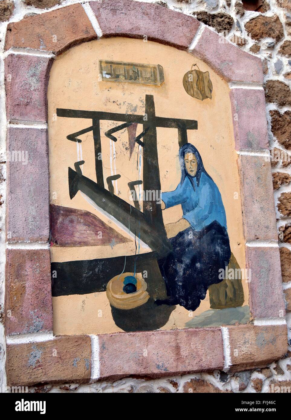 A mural of a weaver of Greek nationality. Stock Photo