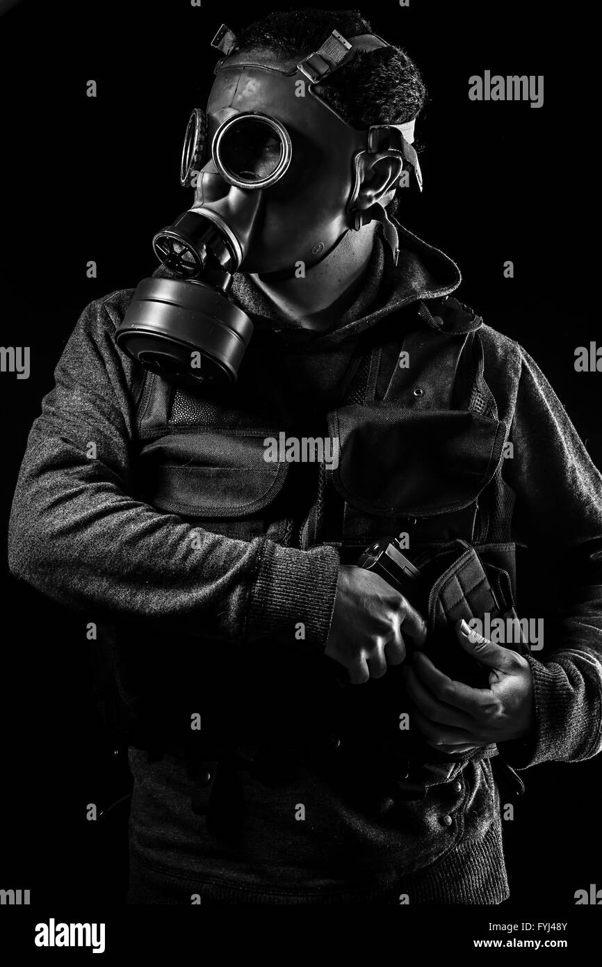 Toxic attack. A man in a gas mask in the smoke. artistic background Stock  Photo - Alamy