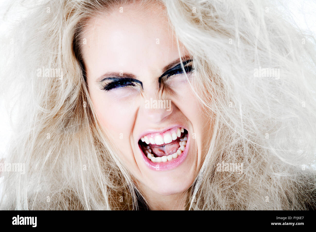 Wildly screaming at you with my white hair Stock Photo