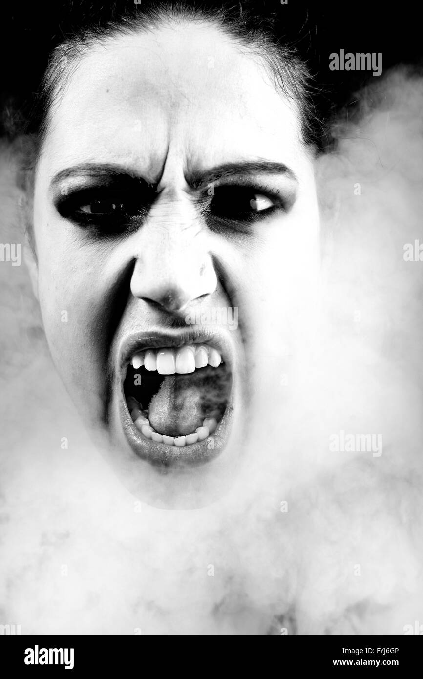 Woman with long curly hair screaming Stock Photo