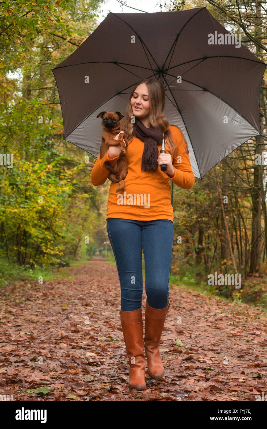 Teen girl walking dog hi-res stock photography and images - Alamy