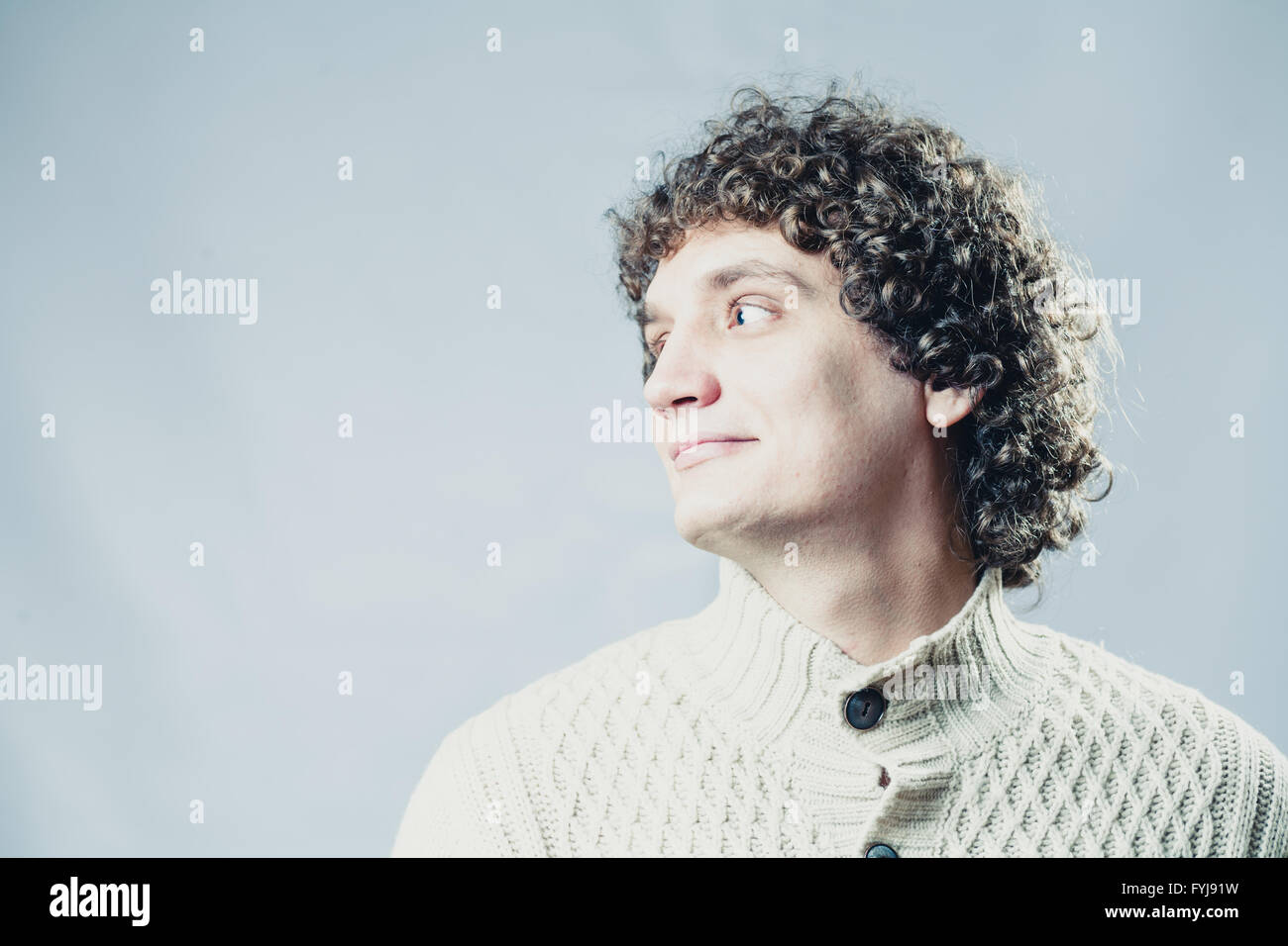 Detailed portrait of a young guy with curly hair Stock Photo - Alamy